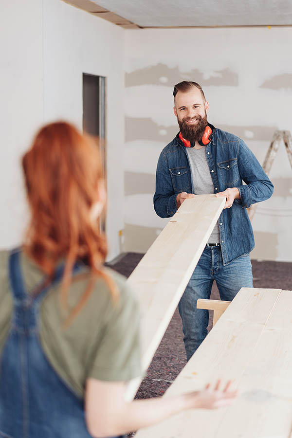 A young couple doing home renovations thanks to their home equity loan.