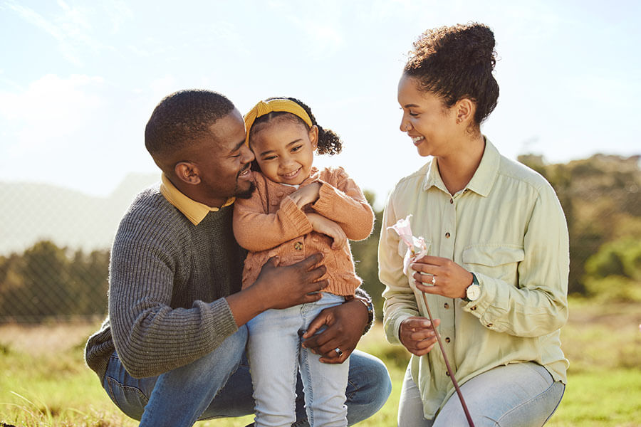A young family of three enjoys time outside together in Philadelphia.