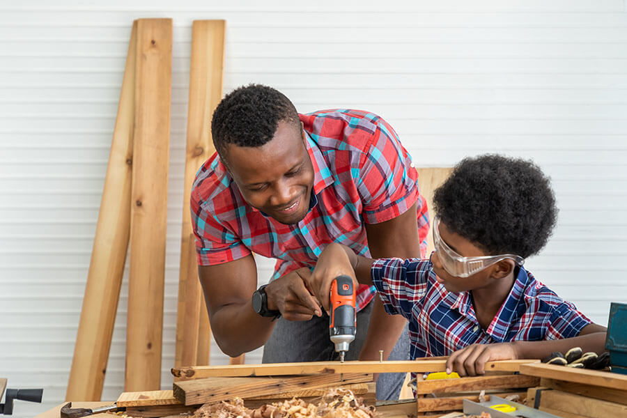 Father and son collaborating on home renovations, made possible with financing through a personal line of credit.