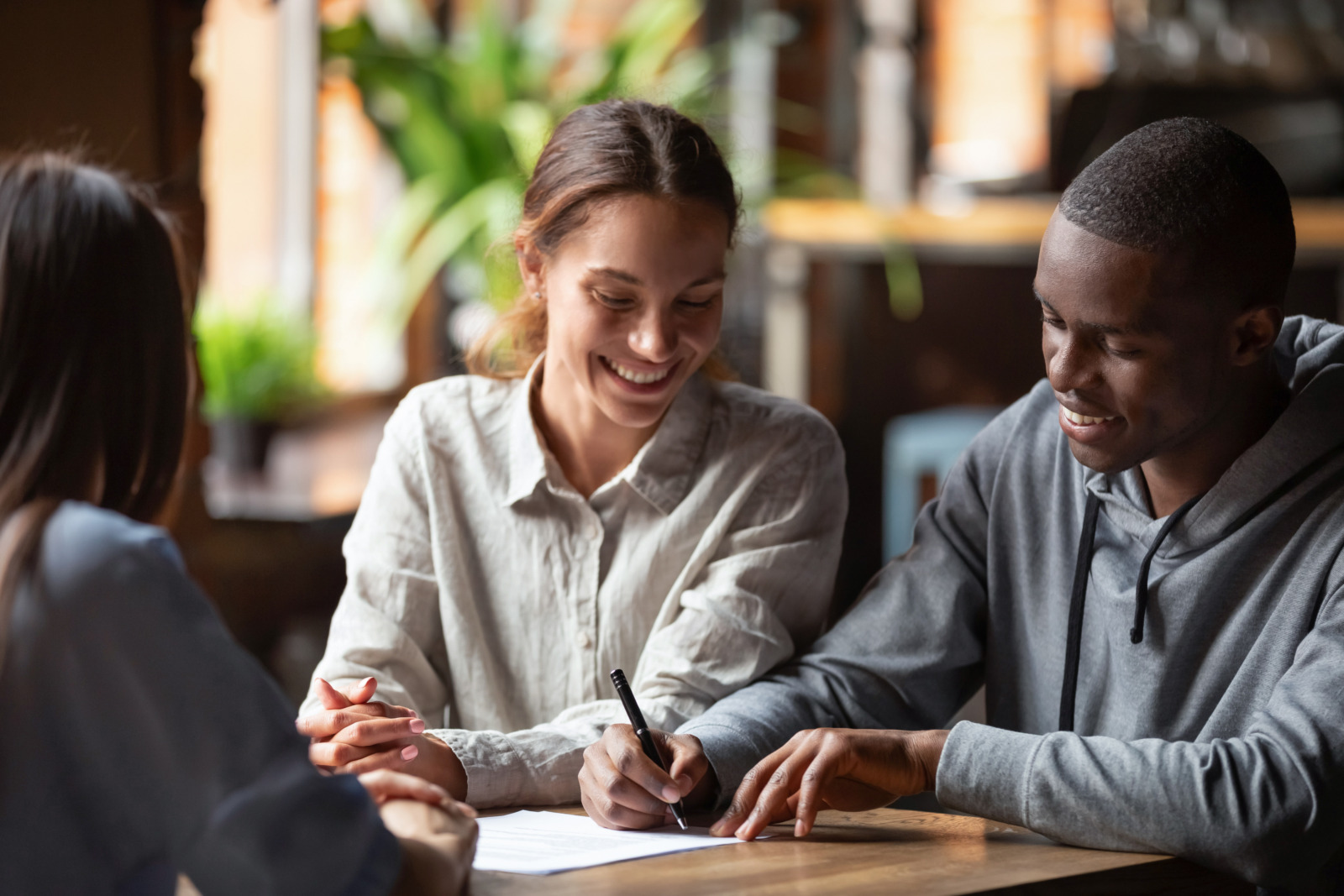A young couple taking out a credit union personal loan to pay for their upcoming wedding ceremony.